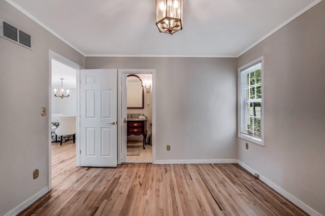 14 Ace Ln, East Stroudsburg, PA 18301 - unfurnished bedroom featuring a chandelier, light wood-style floors, ornamental molding, and baseboards