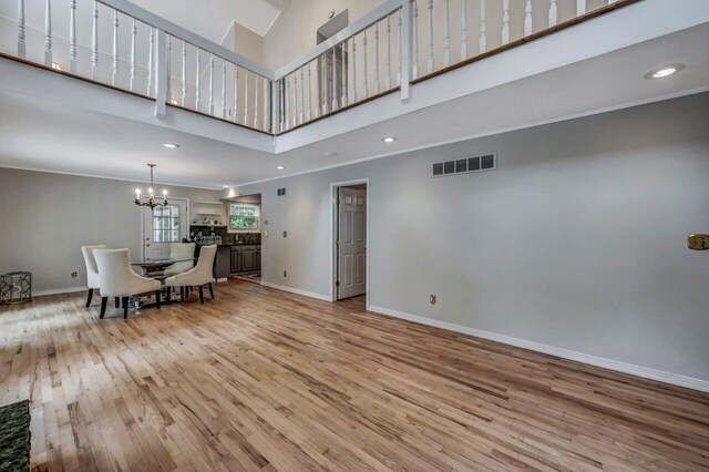 14 Ace Ln, East Stroudsburg, PA 18301 - living area with a towering ceiling, a chandelier, wood finished floors, baseboards, and recessed lighting