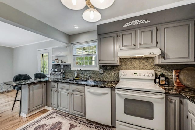 14 Ace Ln, East Stroudsburg, PA 18301 - kitchen featuring white appliances, under cabinet range hood, a sink, gray cabinetry, and light wood-style flooring