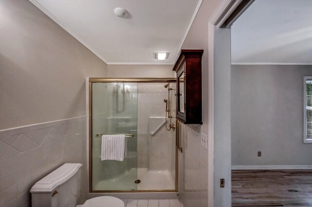 14 Ace Ln, East Stroudsburg, PA 18301 - bathroom with toilet, a shower stall, ornamental molding, wood finished floors, and tile walls