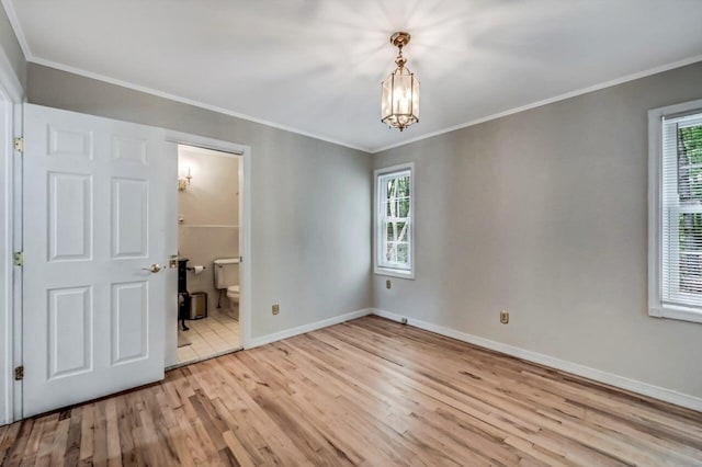 14 Ace Ln, East Stroudsburg, PA 18301 - empty room with wood finished floors, a chandelier, plenty of natural light, baseboards, and crown molding