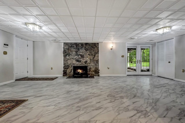 14 Ace Ln, East Stroudsburg, PA 18301 - unfurnished living room with baseboards, marble finish flooring, and a stone fireplace