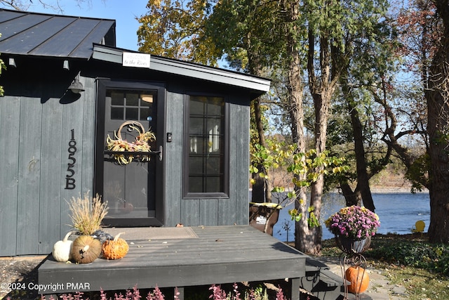 doorway to property with a wooden deck