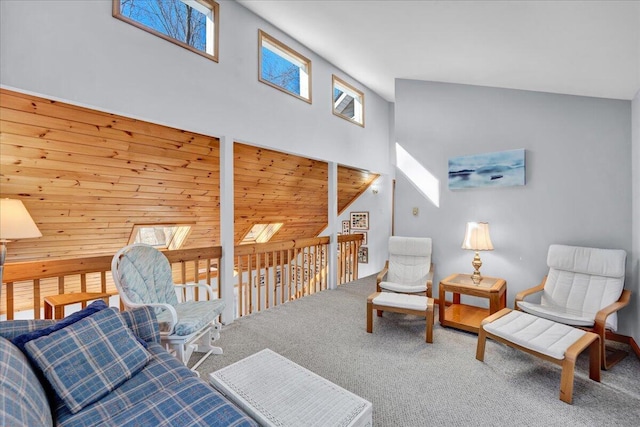 living area featuring carpet floors and high vaulted ceiling