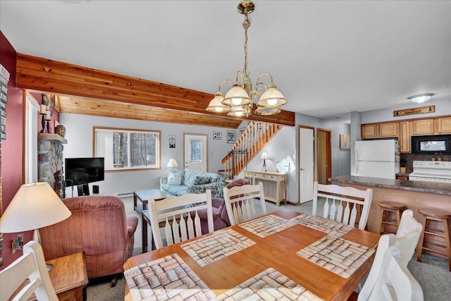 dining space featuring a baseboard radiator, stairway, beamed ceiling, carpet, and an inviting chandelier