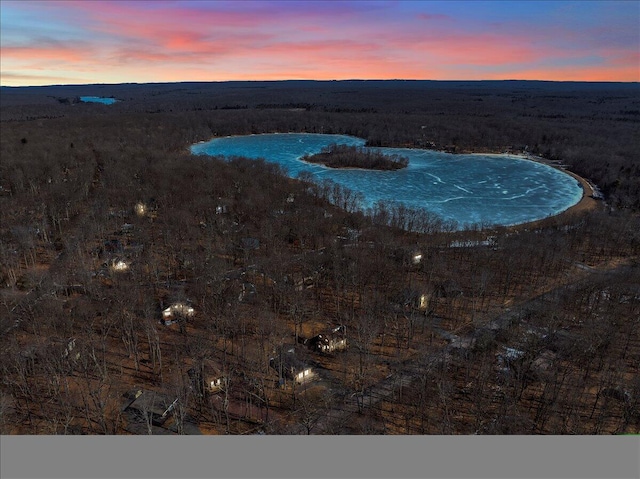 view of pool at dusk