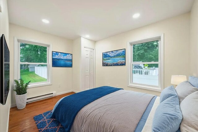 428 Shook Ave, Stroudsburg, PA 18360 - bedroom featuring a baseboard radiator, wood finished floors, and recessed lighting