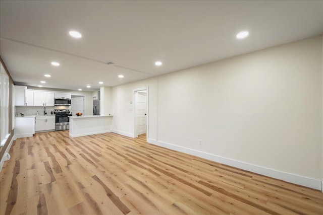 428 Shook Ave, Stroudsburg, PA 18360 - unfurnished living room featuring recessed lighting and light wood-type flooring