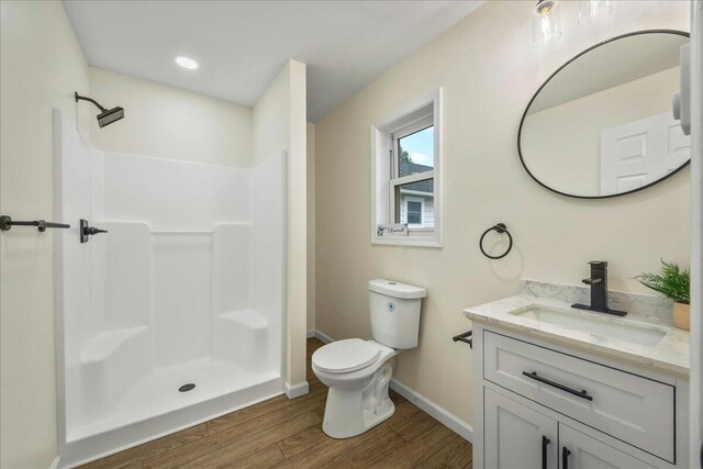 428 Shook Ave, Stroudsburg, PA 18360 - full bathroom featuring wood finished floors, vanity, and a shower