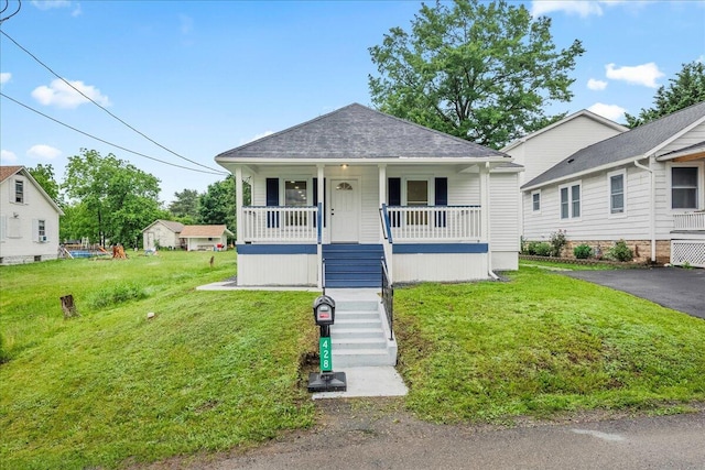 428 Shook Ave, Stroudsburg, PA 18360 - bungalow-style home featuring covered porch, a front yard, stairs, and a shingled roof