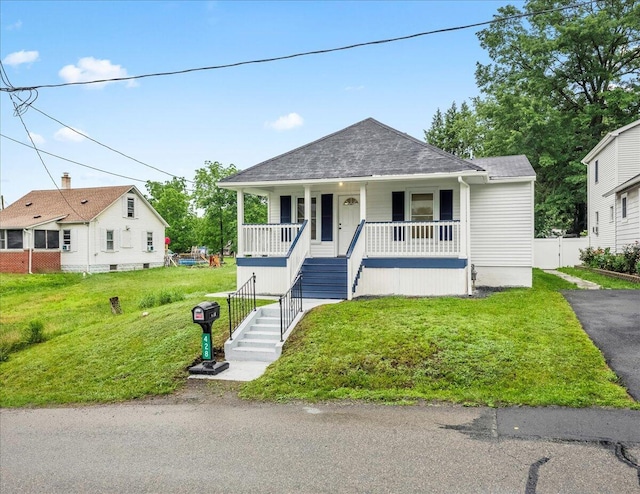 428 Shook Ave, Stroudsburg, PA 18360 - bungalow-style home featuring a porch, stairs, a front yard, a shingled roof, and driveway