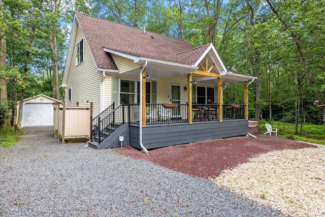 71 Pope Ln, Albrightsville, PA 18210 - view of front facade featuring an outbuilding, roof with shingles, a garage, a porch, and driveway