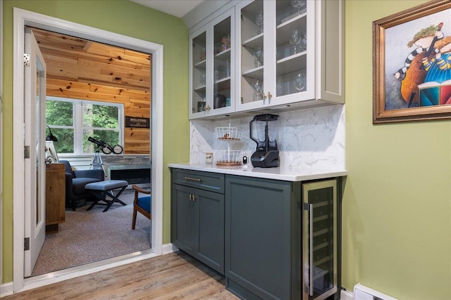71 Pope Ln, Albrightsville, PA 18210 - indoor bar with beverage cooler, backsplash, a baseboard heating unit, and light wood-type flooring