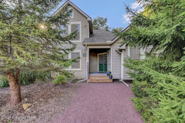 view of front of house with roof with shingles