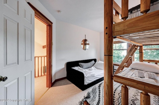 bedroom with carpet floors and baseboards