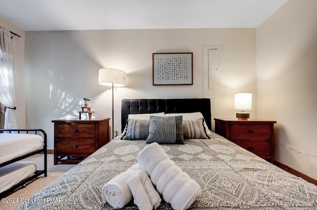 carpeted bedroom with baseboards