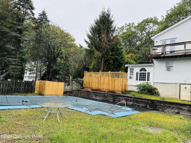 view of yard featuring a fenced in pool and fence