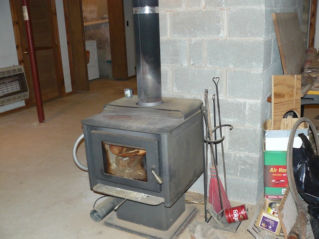 1006 Mill Creek Rd, Newfoundland, PA 18445 - detailed view of heating unit, concrete block wall, and washer / dryer