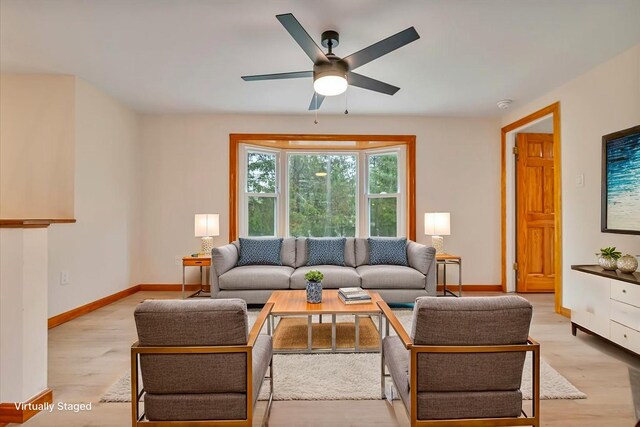 5012 Woodside Dr, Tobyhanna, PA 18466 - living room featuring light wood-type flooring, ceiling fan, and baseboards