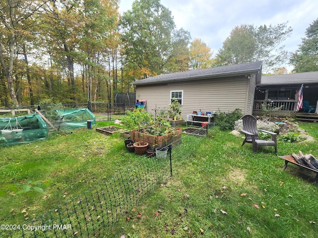 view of yard with a garden and fence