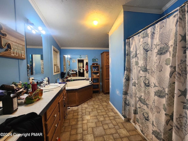 full bath featuring a textured ceiling, vanity, baseboards, ornamental molding, and a shower with curtain