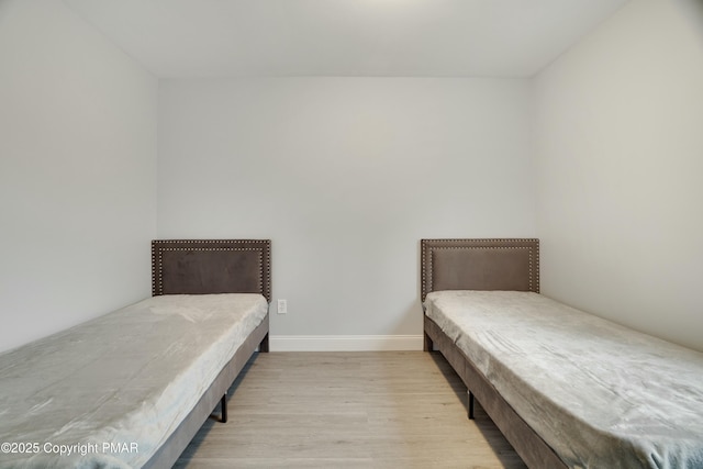 bedroom featuring light wood-type flooring