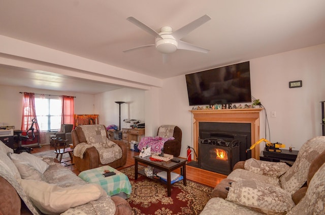 living area featuring a ceiling fan and wood finished floors