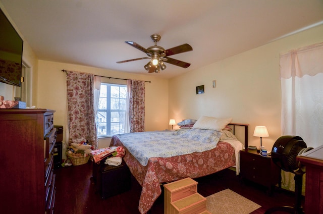 bedroom with wood finished floors and ceiling fan