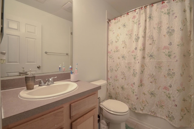 full bath featuring vanity, shower / tub combo, and toilet