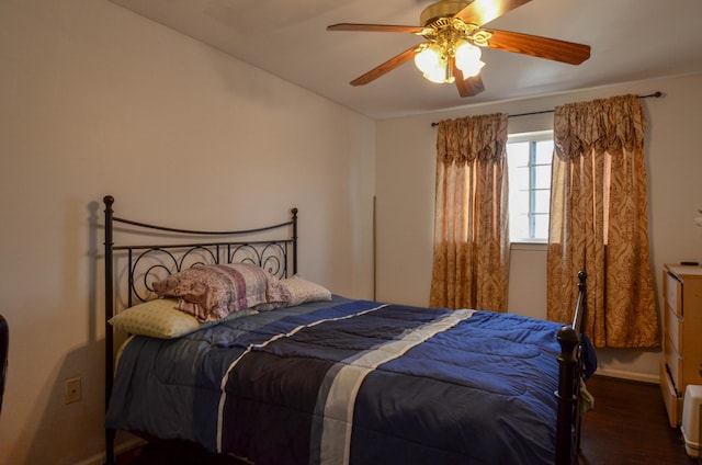 bedroom with a ceiling fan and wood finished floors