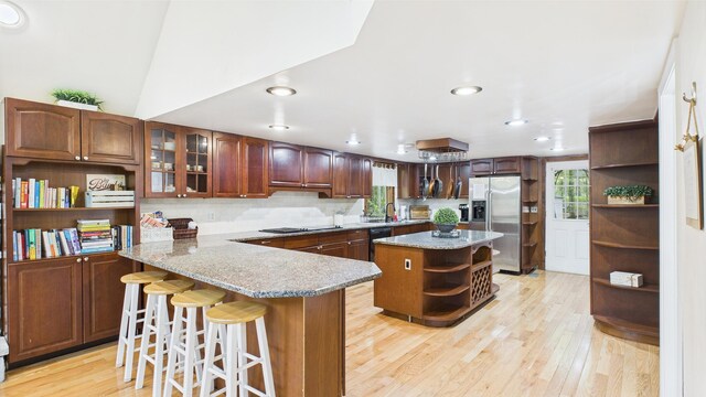 112 Moshannon Dr, Pocono Lake, PA 18347 - kitchen featuring open shelves, black appliances, light wood finished floors, a breakfast bar, and recessed lighting