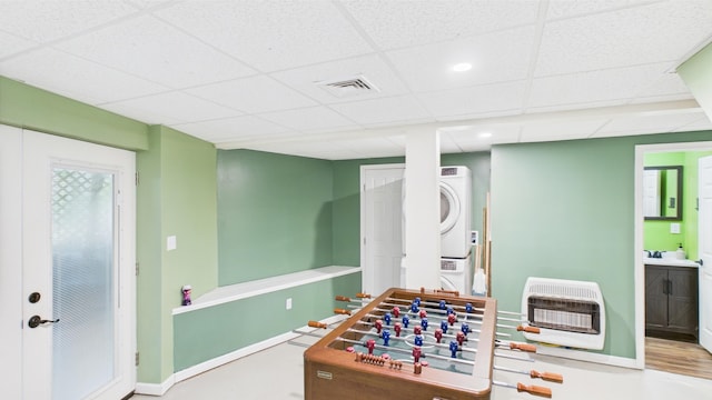 112 Moshannon Dr, Pocono Lake, PA 18347 - rec room featuring heating unit, stacked washer / drying machine, a drop ceiling, and baseboards