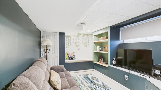 112 Moshannon Dr, Pocono Lake, PA 18347 - living room with built in features, a paneled ceiling, and baseboards