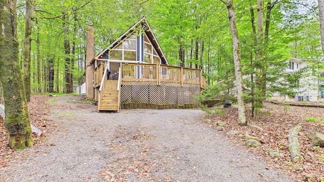 112 Moshannon Dr, Pocono Lake, PA 18347 - view of front of home featuring stairway, a wooden deck, and a sunroom