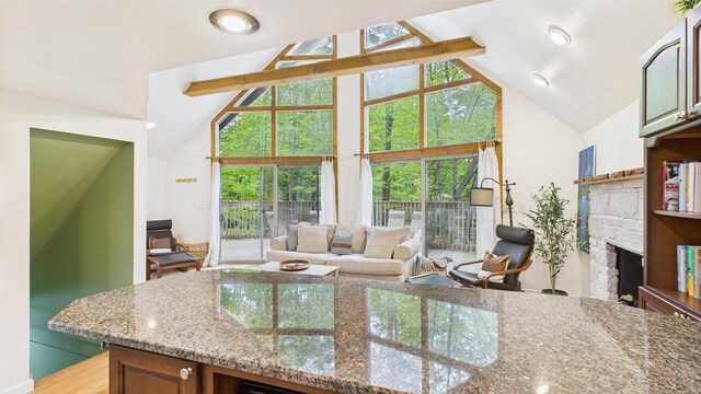 112 Moshannon Dr, Pocono Lake, PA 18347 - living area with a fireplace, healthy amount of natural light, and high vaulted ceiling