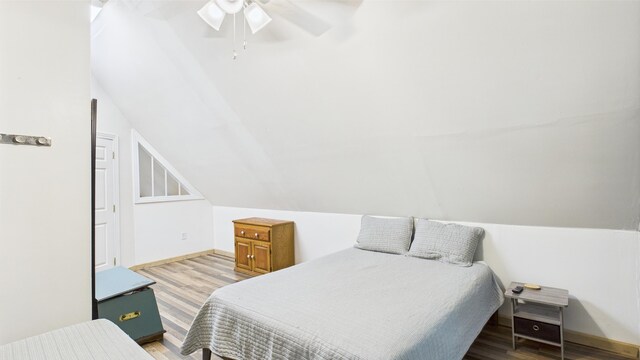 112 Moshannon Dr, Pocono Lake, PA 18347 - bedroom featuring wood finished floors, baseboards, a ceiling fan, and vaulted ceiling