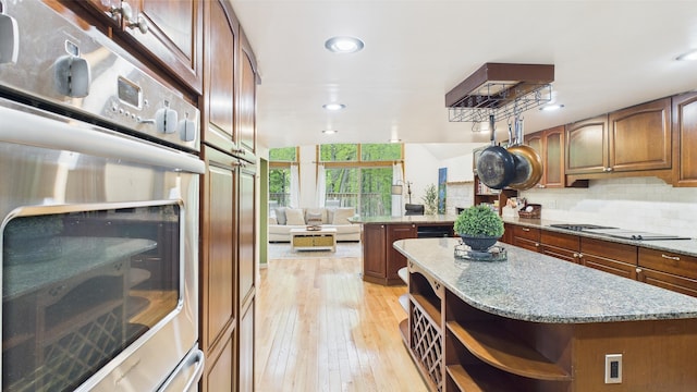112 Moshannon Dr, Pocono Lake, PA 18347 - kitchen featuring open shelves, stovetop, oven, backsplash, and light wood-style flooring