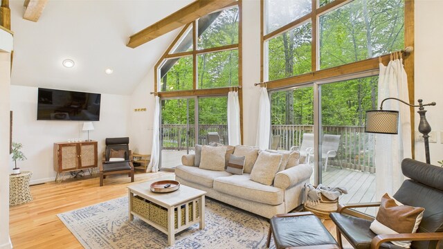 112 Moshannon Dr, Pocono Lake, PA 18347 - living area featuring high vaulted ceiling, beam ceiling, wood finished floors, recessed lighting, and baseboards