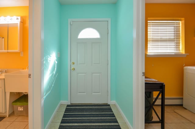 1214 Shadblow Rd, Pocono Summit, PA 18346 - foyer featuring baseboard heating, washer / dryer, and light tile patterned flooring