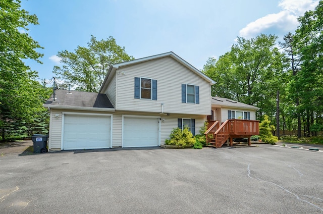 1214 Shadblow Rd, Pocono Summit, PA 18346 - split level home featuring driveway, a deck, and stairway