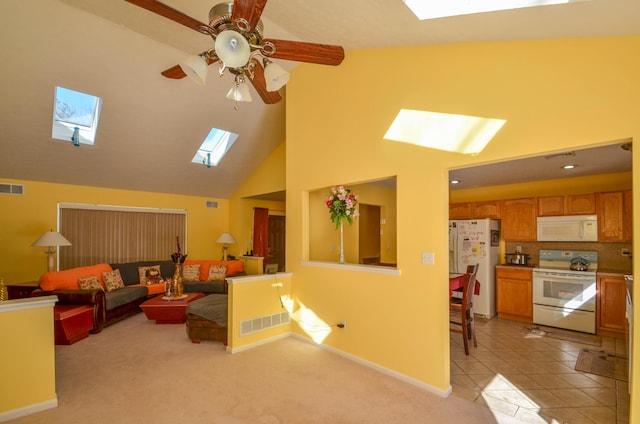 1214 Shadblow Rd, Pocono Summit, PA 18346 - living room with a skylight, ceiling fan, high vaulted ceiling, and light carpet