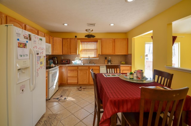 1214 Shadblow Rd, Pocono Summit, PA 18346 - kitchen featuring white appliances, backsplash, light countertops, recessed lighting, and light tile patterned flooring