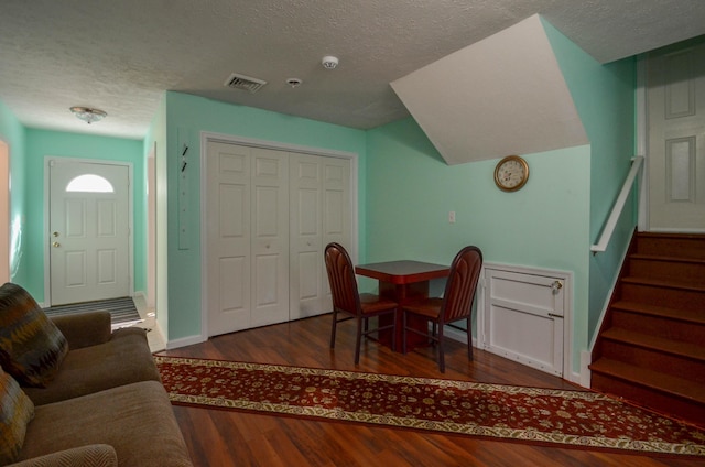 1214 Shadblow Rd, Pocono Summit, PA 18346 - dining room featuring wood finished floors, a textured ceiling, and stairway