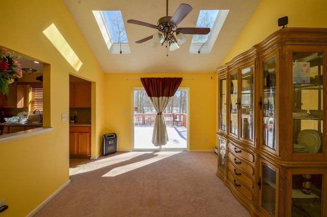 1214 Shadblow Rd, Pocono Summit, PA 18346 - unfurnished living room with a skylight, light carpet, high vaulted ceiling, and a ceiling fan