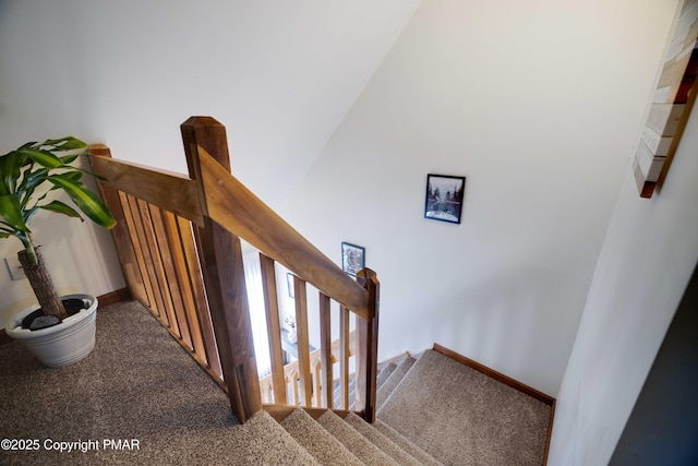 stairs featuring carpet floors and baseboards