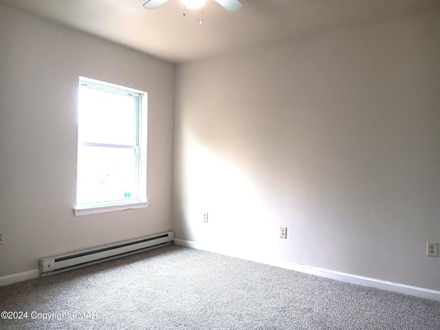 empty room with a baseboard radiator, ceiling fan, and carpet