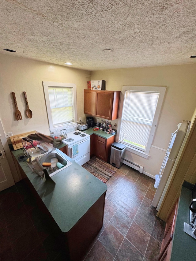 373-375 N Courtland St, East Stroudsburg, PA 18301 - kitchen featuring white range with electric cooktop, brown cabinets, baseboard heating, a textured ceiling, and a sink