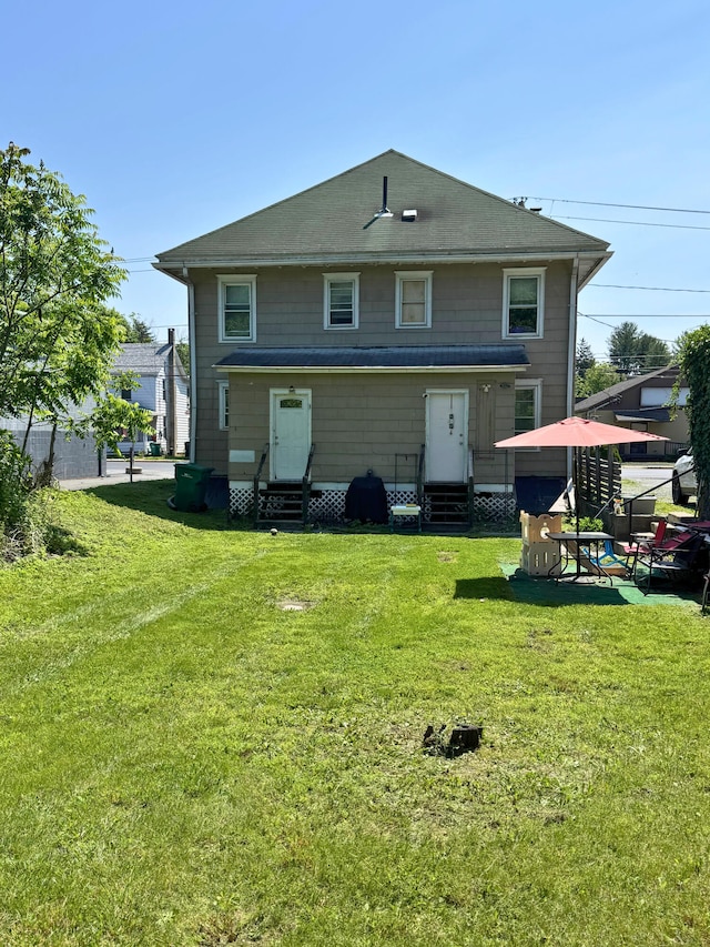 373-375 N Courtland St, East Stroudsburg, PA 18301 - back of property featuring entry steps and a yard
