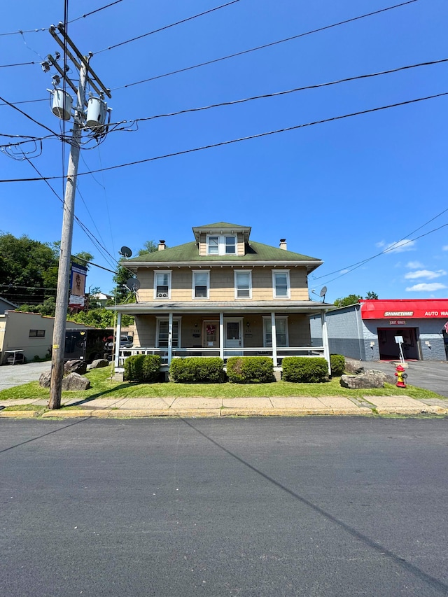 373-375 N Courtland St, East Stroudsburg, PA 18301 - view of front of home with a porch and a chimney