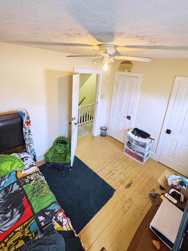373-375 N Courtland St, East Stroudsburg, PA 18301 - bedroom with wood-type flooring, a textured ceiling, ceiling fan, and baseboards